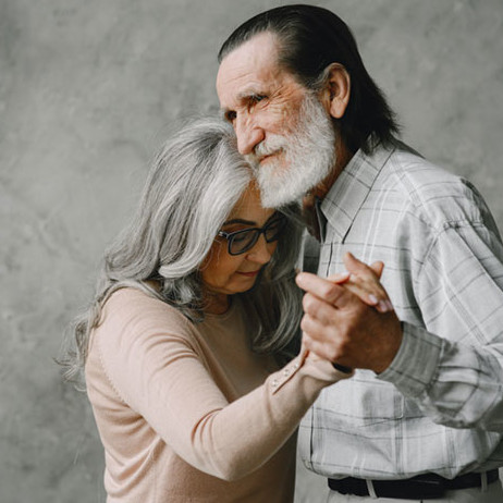 elderly couple dancing
