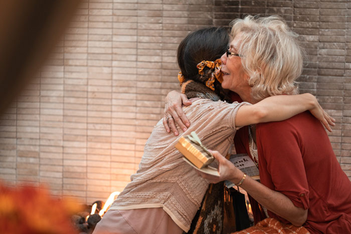 grandmother and granddaughter embracing